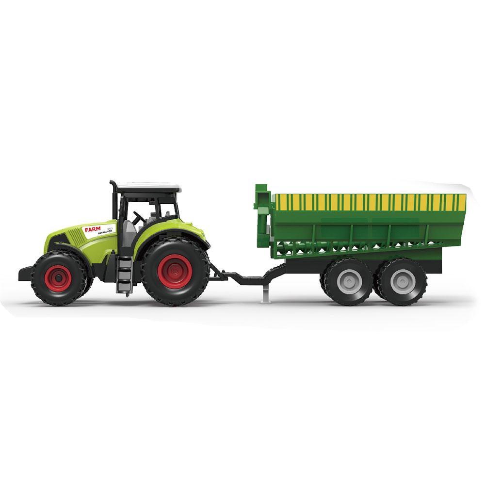 Traktor sa zelenom prikolicom