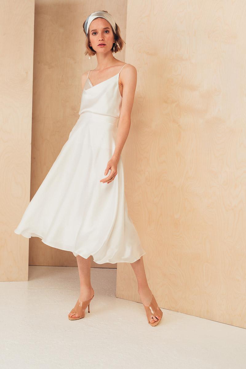 MIONE Ženska midi svilena suknja opuštenog kroja bela