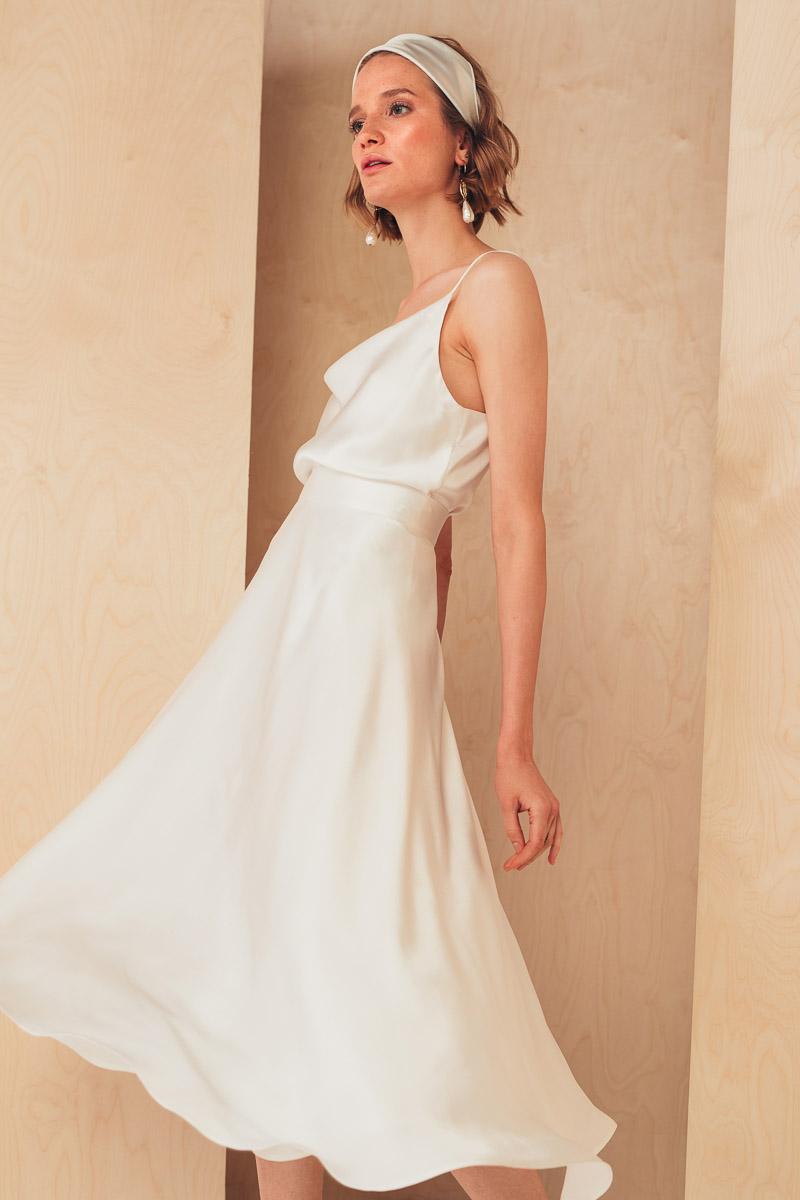Selected image for MIONE Ženska midi svilena suknja opuštenog kroja bela